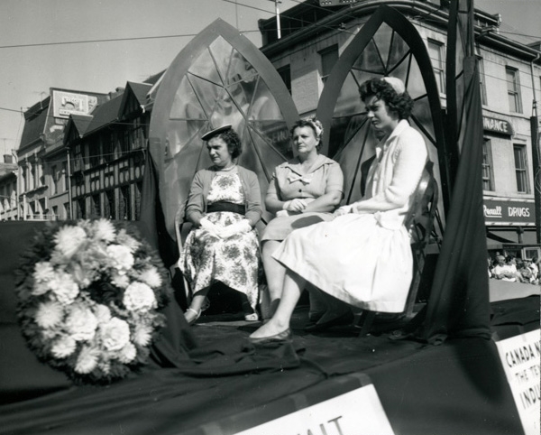 Some ladies riding on an unidentified float during the Labour Day Parade on September 6, 1960. They have just gone past the intersection of King and James Streets and are continuing up James Street. Some ladies riding on an unidentified float during the Labour Day Parade on September 6, 1960. They have just gone past the intersection of King and James Streets and are continuing up James Street.