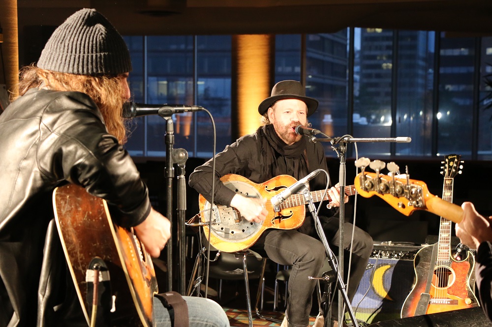 Photo of Colin Linden and Tom Wilson doing a sound check before the Blackie and the Rodeo Kings concert