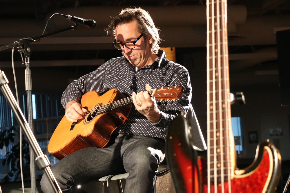 Photo of Stephen Fearing doing a sound check before the Blackie and the Rodeo Kings concert