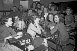 Students using an old-style phone at the Bell Homestead.