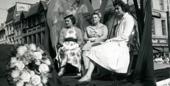 Some ladies riding on an unidentified float during the Labour Day Parade on September 6, 1960. They have just gone past the intersection of King and James Streets and are continuing up James Street. Some ladies riding on an unidentified float during the Labour Day Parade on September 6, 1960. They have just gone past the intersection of King and James Streets and are continuing up James Street.