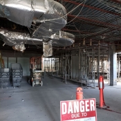 Valley park branch construction. Inside of building pictured with a caution sign 