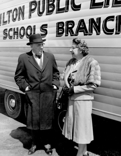 Photo of Mayor Lloyd D. Jackson and Freda Waldon, Chief Librarian in front of a Bookmobile in 1961, Hamilton Spectator